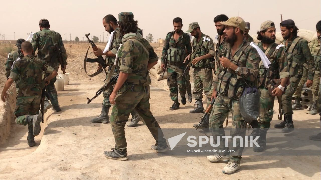 Syrian army and people's militia during offensive operation near al-Jafra in Deir-ez-Zor