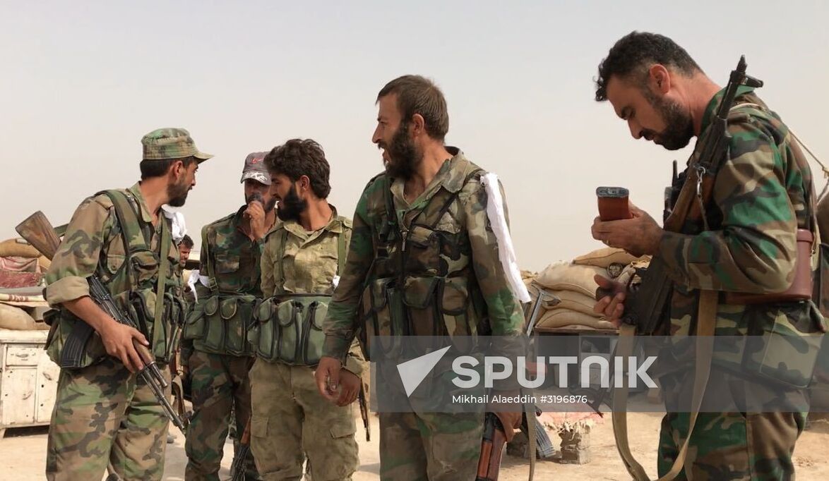 Syrian army and people's militia during offensive operation near al-Jafra in Deir-ez-Zor