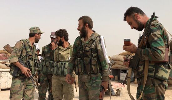 Syrian army and people's militia during offensive operation near al-Jafra in Deir-ez-Zor