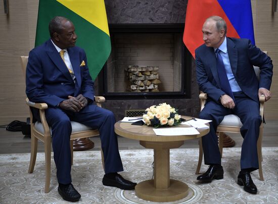 Russian President Vladimir Putin meets with President of Guinea Alpha Conde