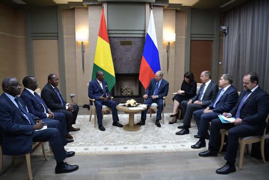 Russian President Vladimir Putin meets with President of Guinea Alpha Conde