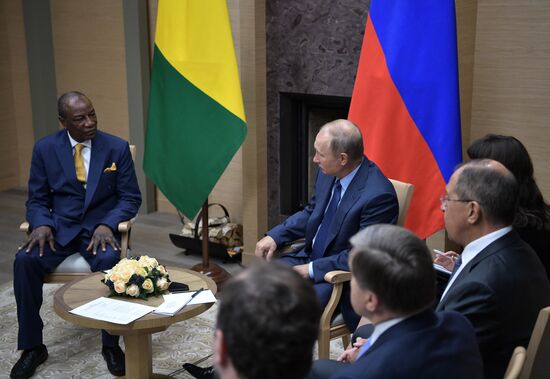 Russian President Vladimir Putin meets with President of Guinea Alpha Conde