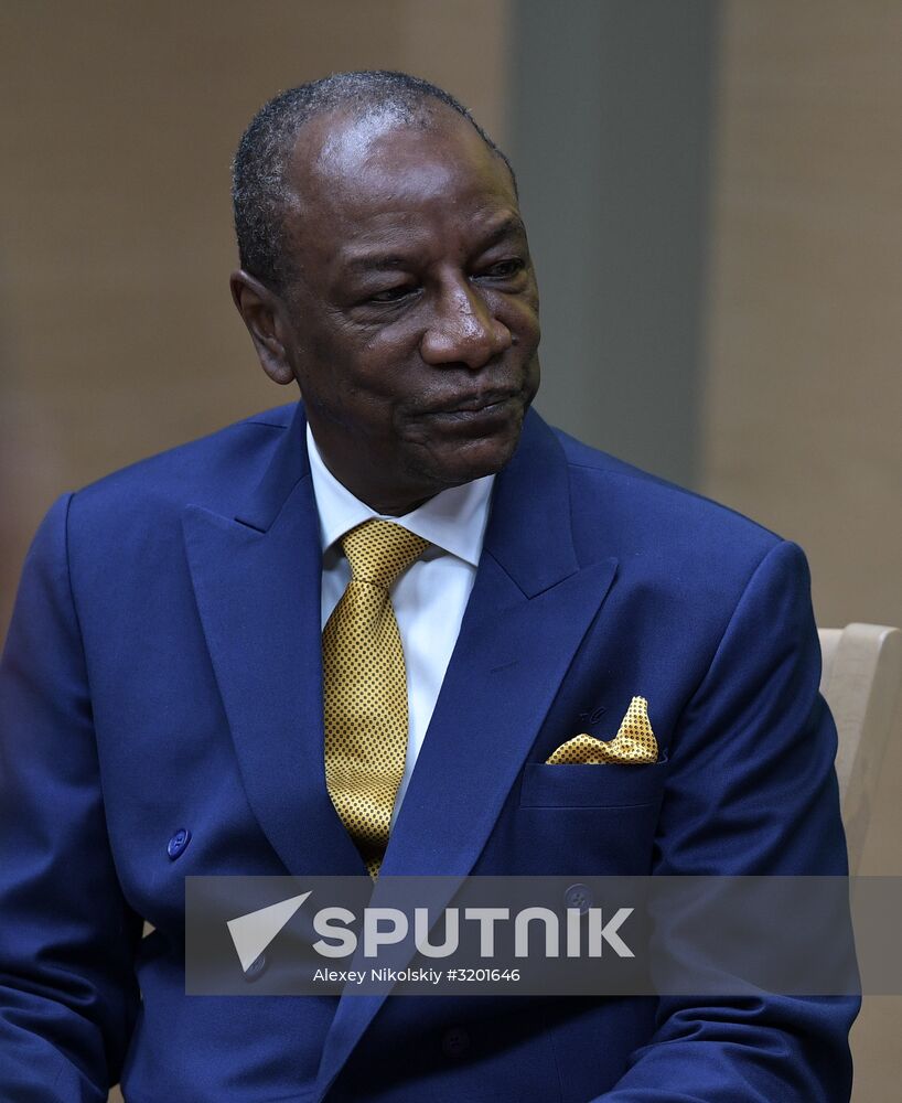 Russian President Vladimir Putin meets with President of Guinea Alpha Conde