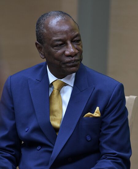 Russian President Vladimir Putin meets with President of Guinea Alpha Conde