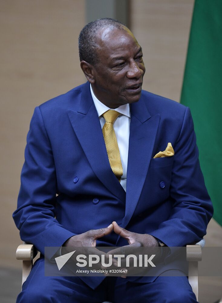 Russian President Vladimir Putin meets with President of Guinea Alpha Conde