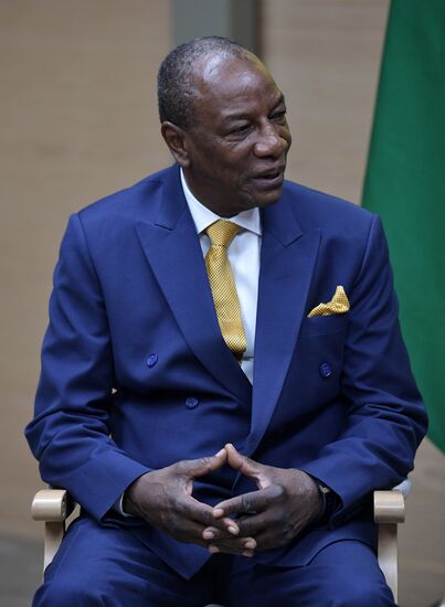 Russian President Vladimir Putin meets with President of Guinea Alpha Conde