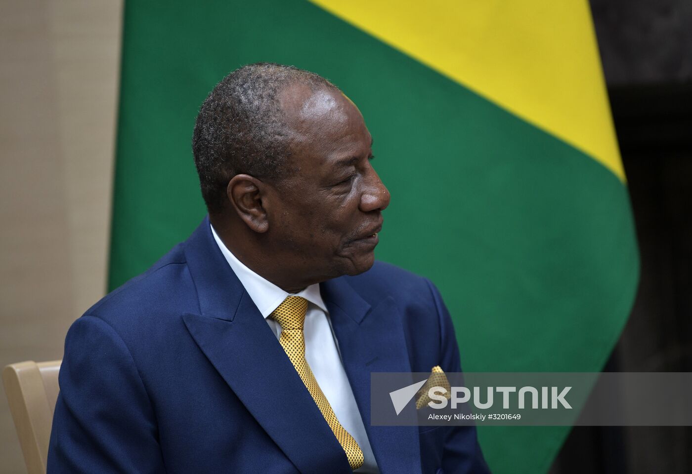 Russian President Vladimir Putin meets with President of Guinea Alpha Conde