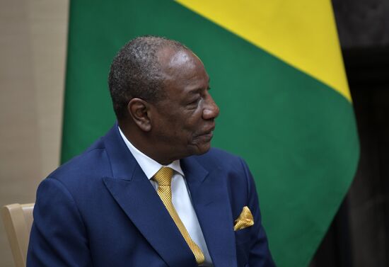 Russian President Vladimir Putin meets with President of Guinea Alpha Conde