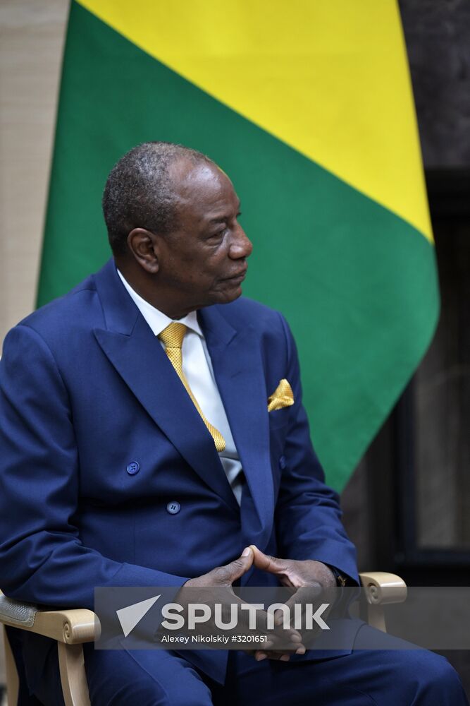 Russian President Vladimir Putin meets with President of Guinea Alpha Conde