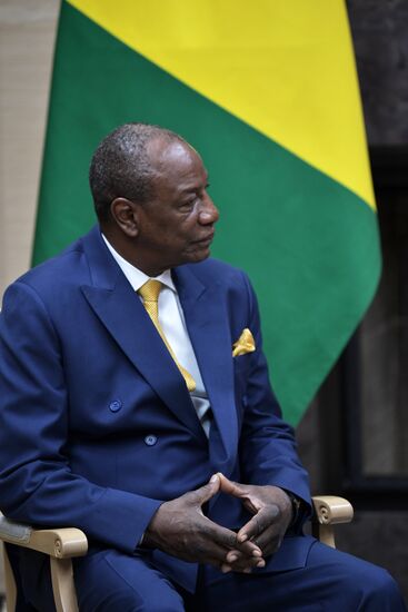 Russian President Vladimir Putin meets with President of Guinea Alpha Conde