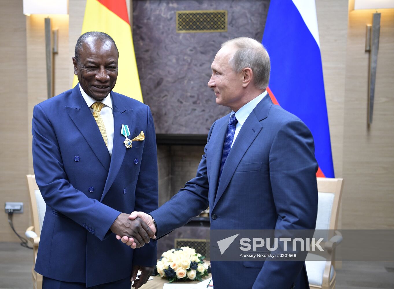Russian President Vladimir Putin meets with President of Guinea Alpha Conde