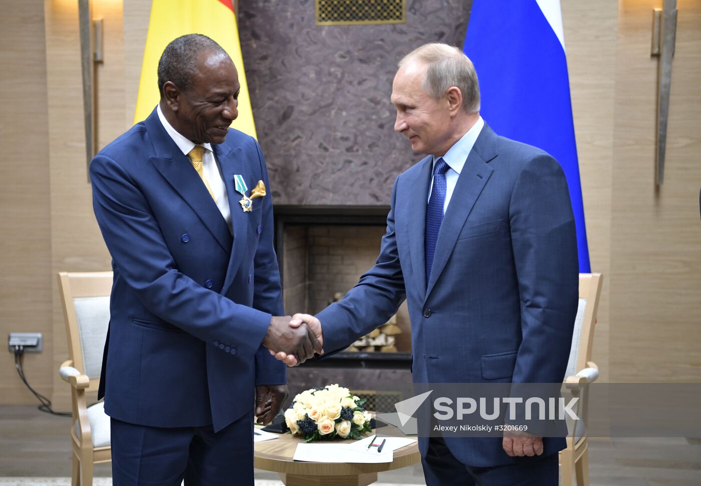 Russian President Vladimir Putin meets with President of Guinea Alpha Conde