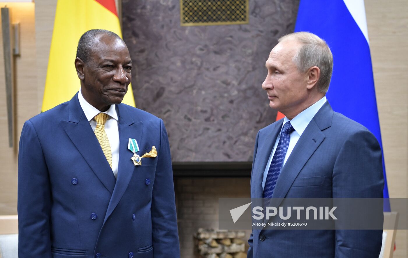 Russian President Vladimir Putin meets with President of Guinea Alpha Conde