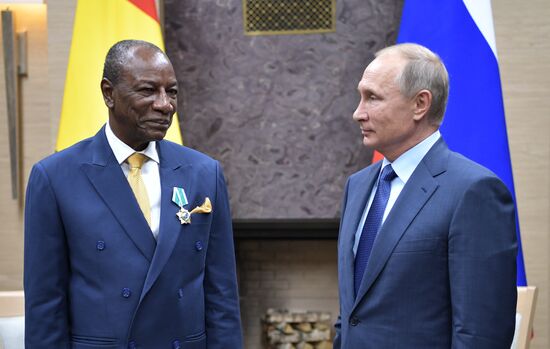 Russian President Vladimir Putin meets with President of Guinea Alpha Conde