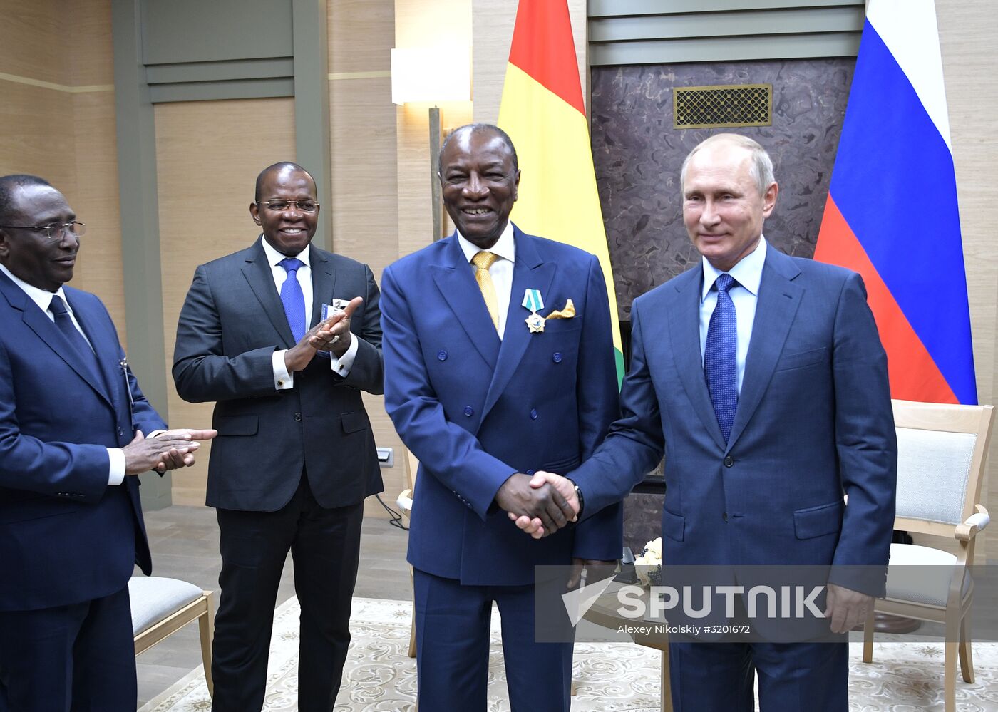 Russian President Vladimir Putin meets with President of Guinea Alpha Conde