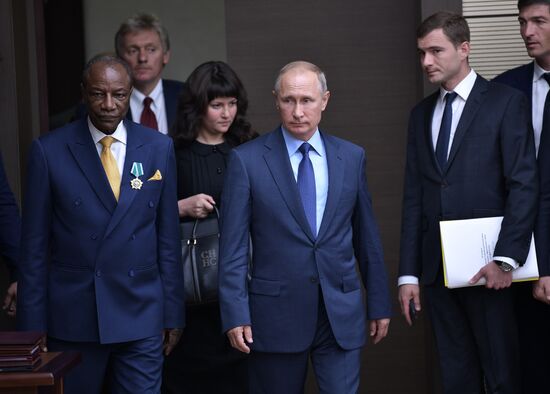 Russian President Vladimir Putin meets with President of Guinea Alpha Conde