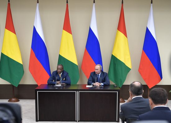 Russian President Vladimir Putin meets with President of Guinea Alpha Conde