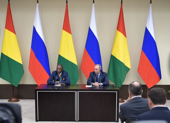 Russian President Vladimir Putin meets with President of Guinea Alpha Conde