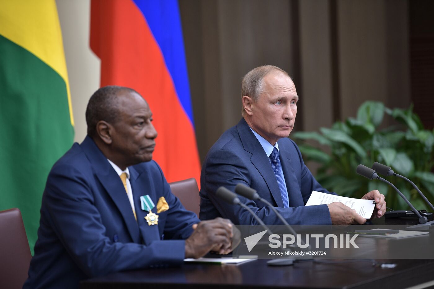 Russian President Vladimir Putin meets with President of Guinea Alpha Conde