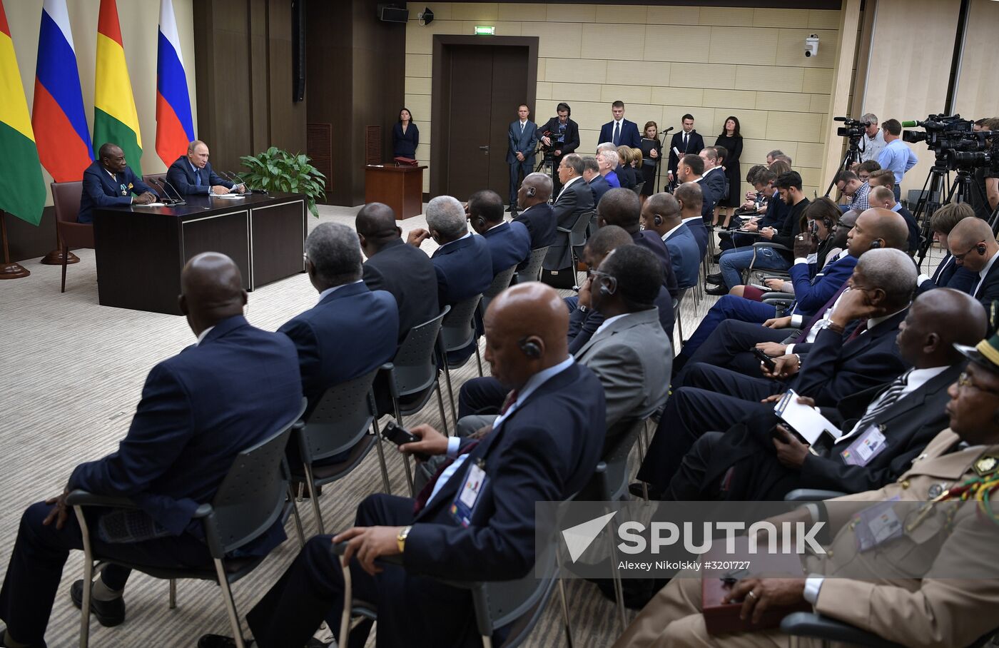 Russian President Vladimir Putin meets with President of Guinea Alpha Conde