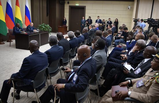 Russian President Vladimir Putin meets with President of Guinea Alpha Conde