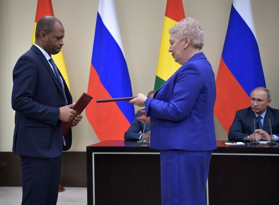 Russian President Vladimir Putin meets with President of Guinea Alpha Conde
