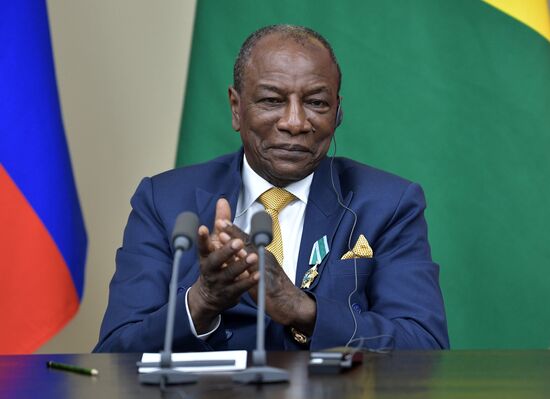 Russian President Vladimir Putin meets with President of Guinea Alpha Conde