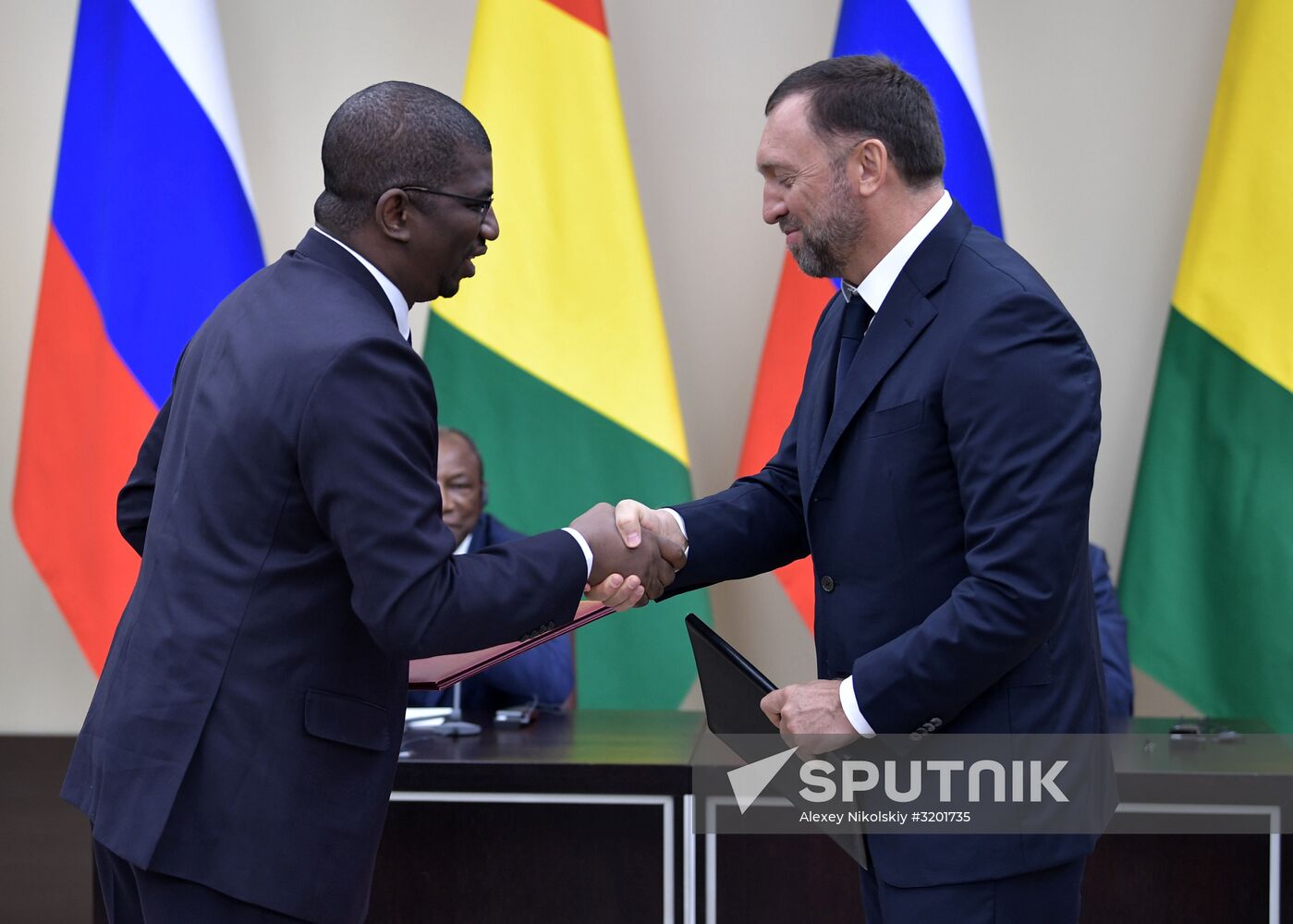 Russian President Vladimir Putin meets with President of Guinea Alpha Conde