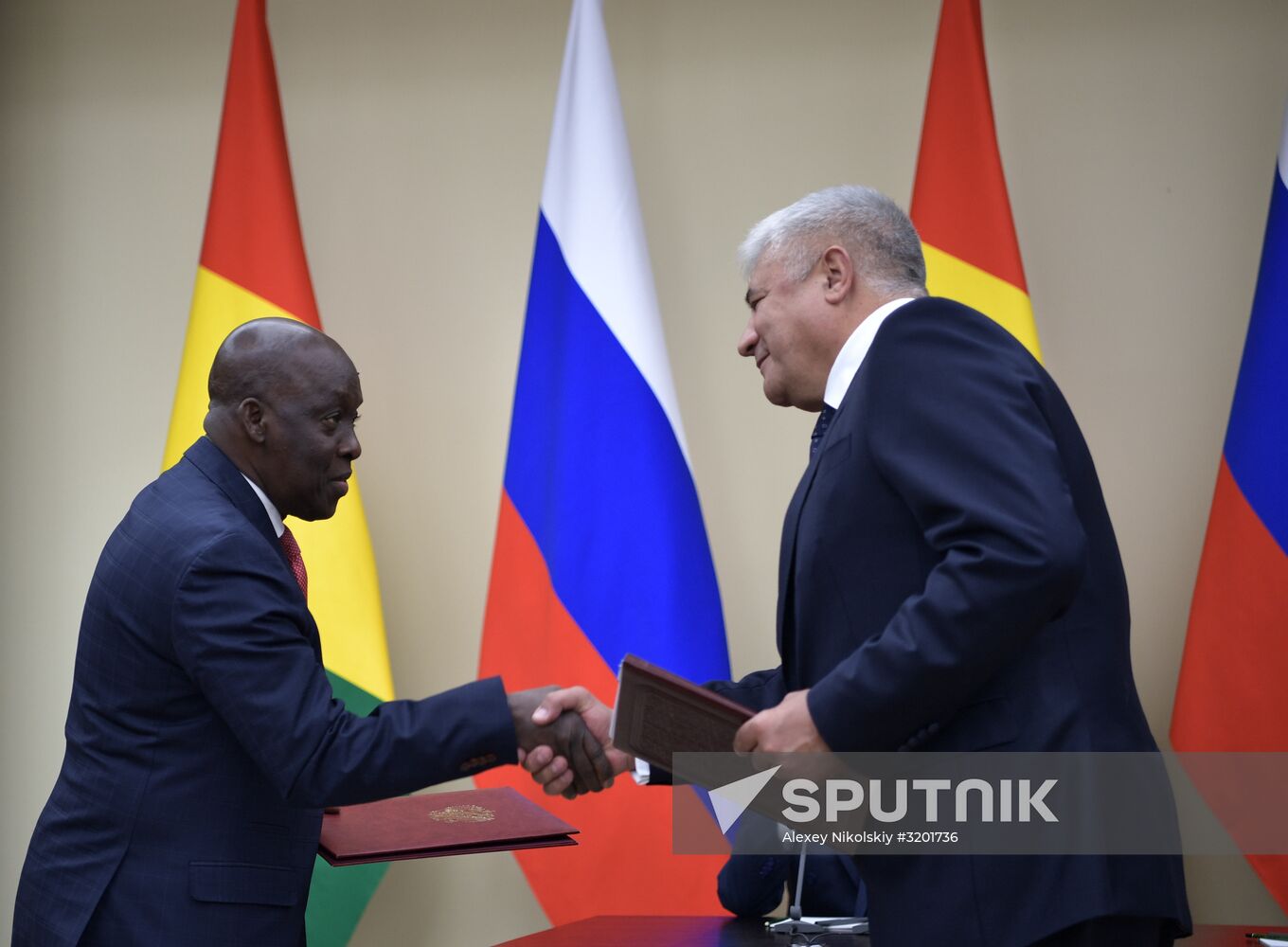 Russian President Vladimir Putin meets with President of Guinea Alpha Conde