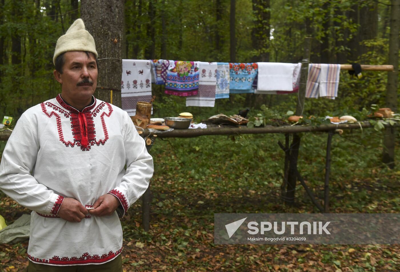 Mari native religion followers hold prayer service in sacred grove