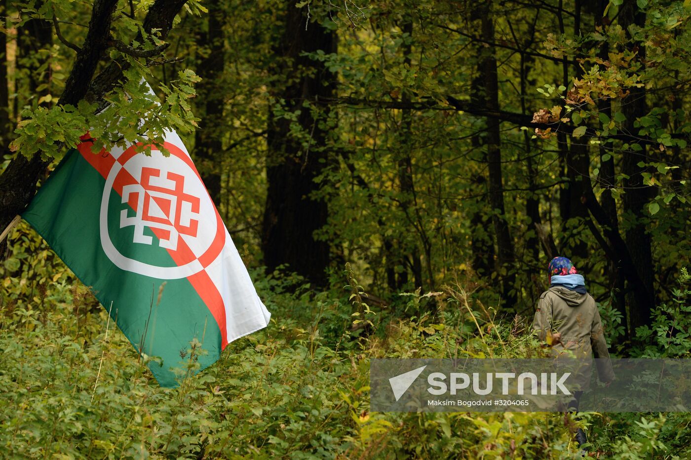 Mari native religion followers hold prayer service in sacred grove