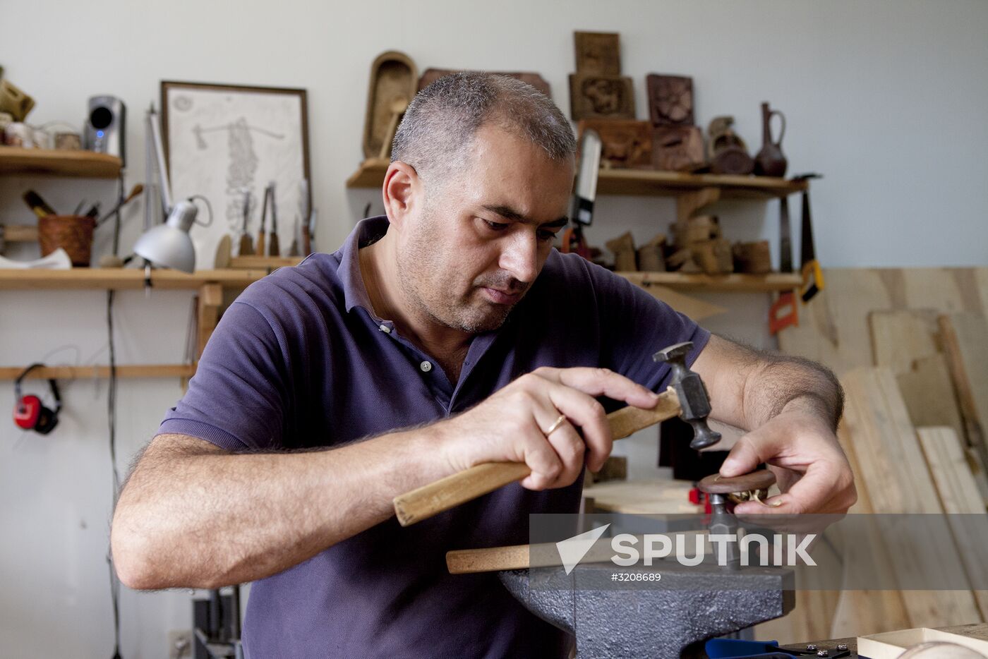 Making jewelry at workshop in Tskhinval