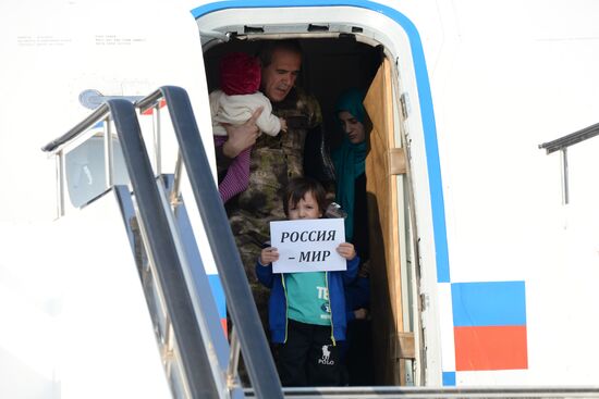 Russian children rescued in Syria are met at Grozny airport