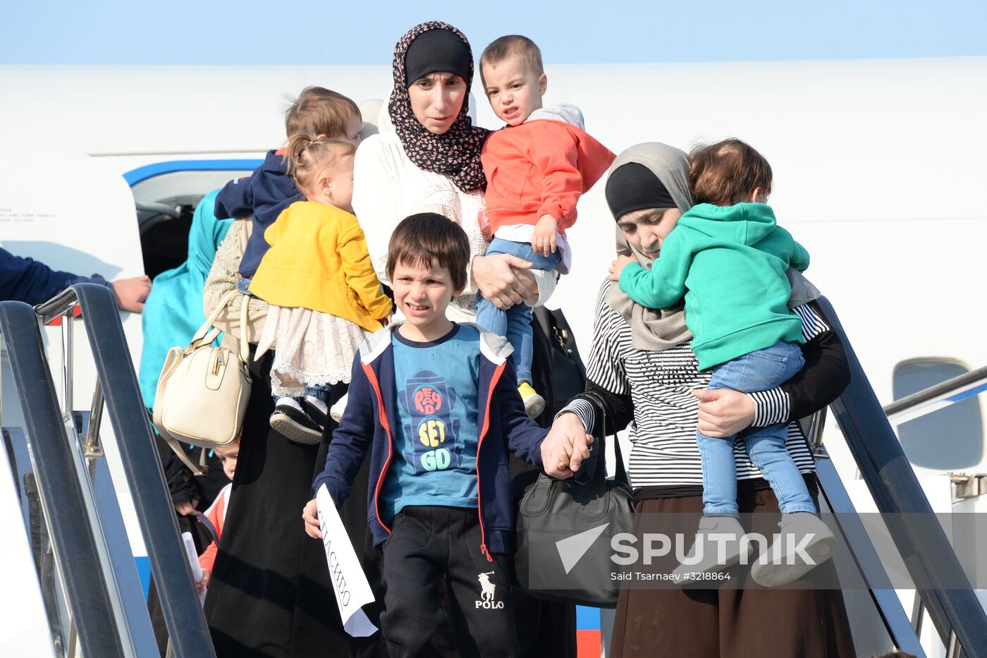 Russian children rescued in Syria are met at Grozny airport