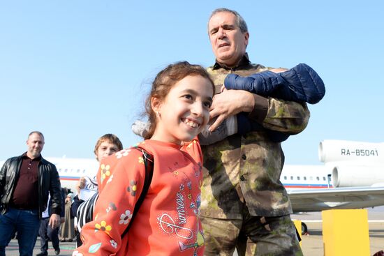Russian children rescued in Syria are met at Grozny airport