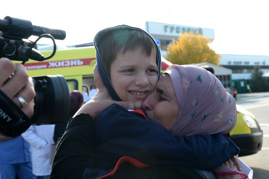 Russian children rescued in Syria are met at Grozny airport