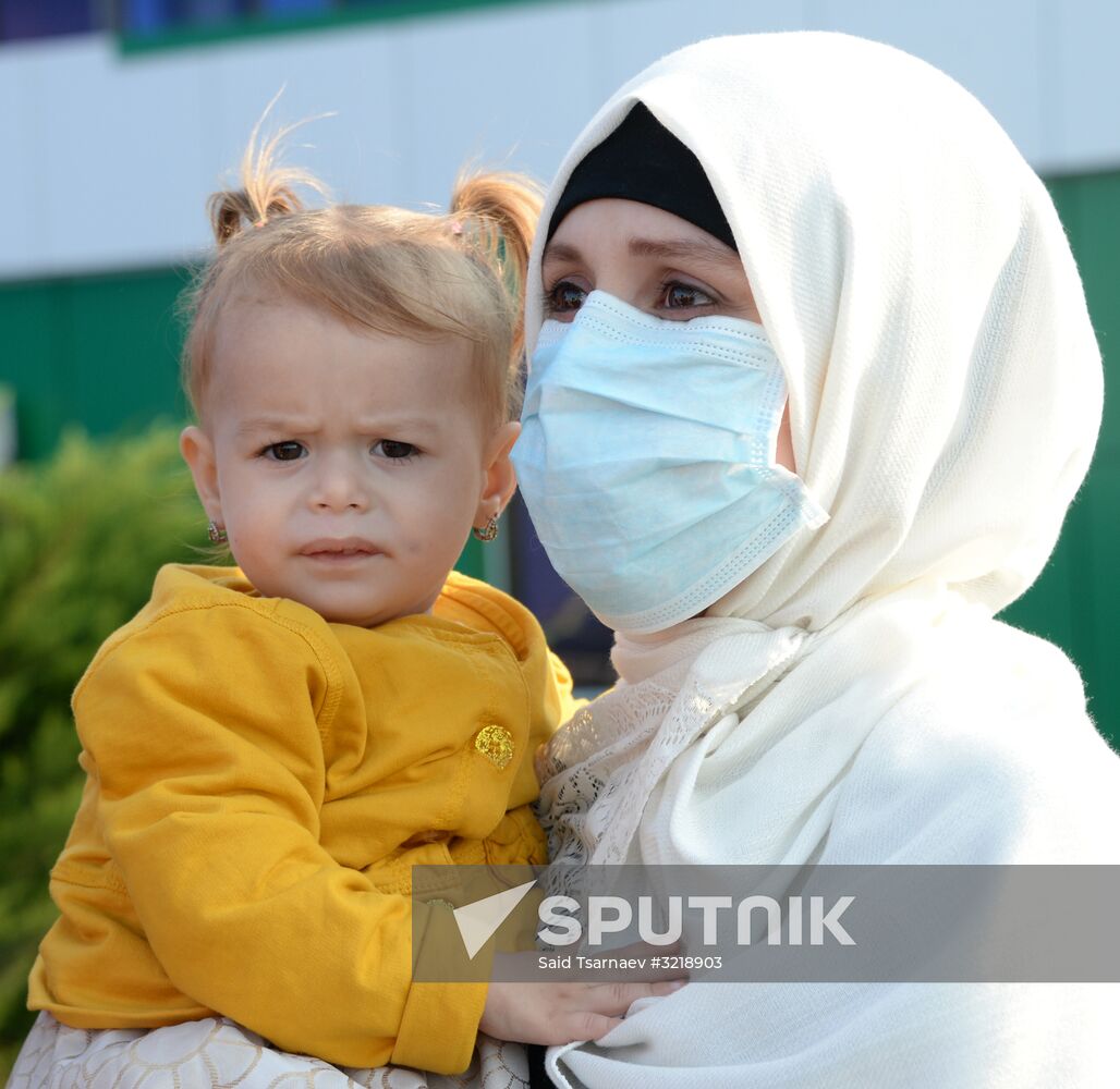 Russian children rescued in Syria are met at Grozny airport