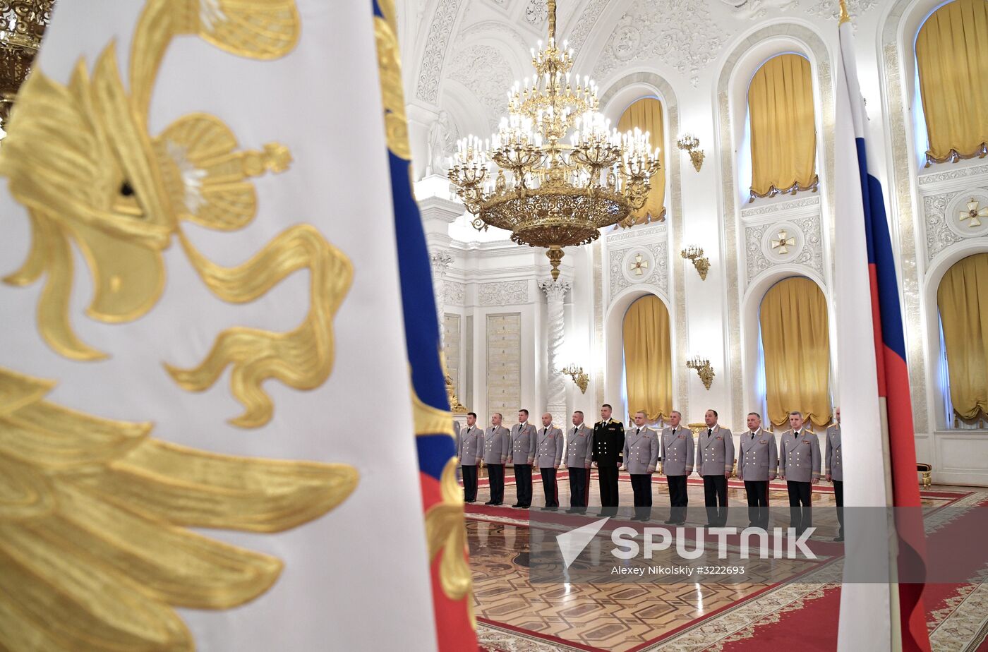 Russian President Vladimir Putin meets with senior officers at the Kremlin