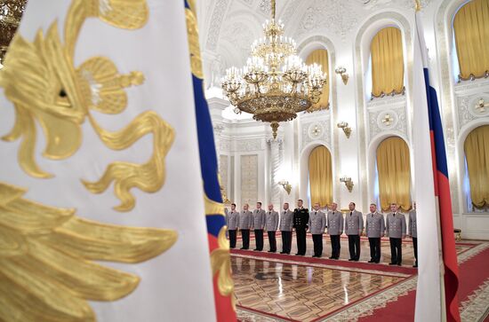 Russian President Vladimir Putin meets with senior officers at the Kremlin