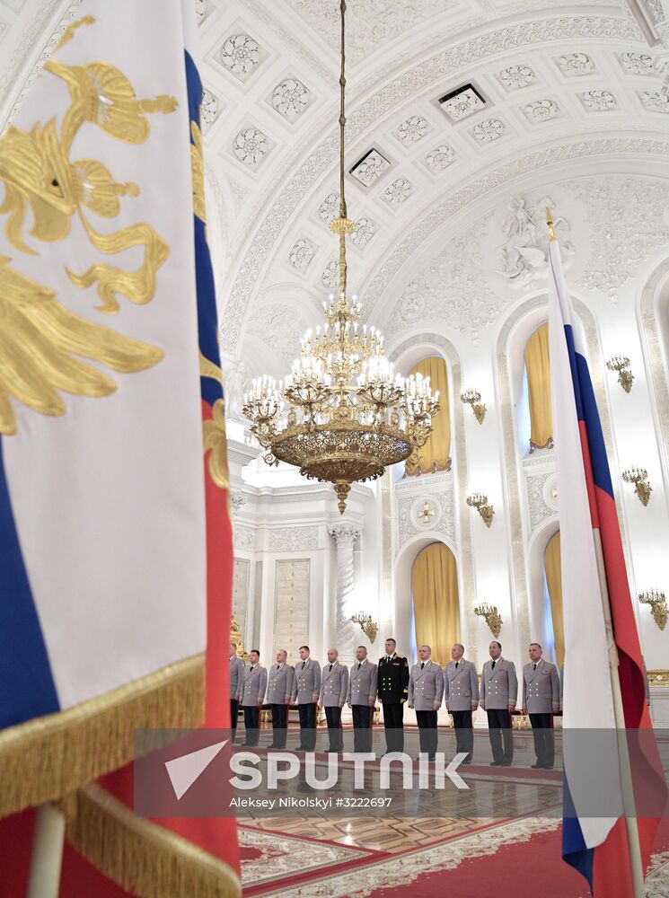 Russian President Vladimir Putin meets with senior officers at the Kremlin