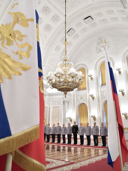 Russian President Vladimir Putin meets with senior officers at the Kremlin