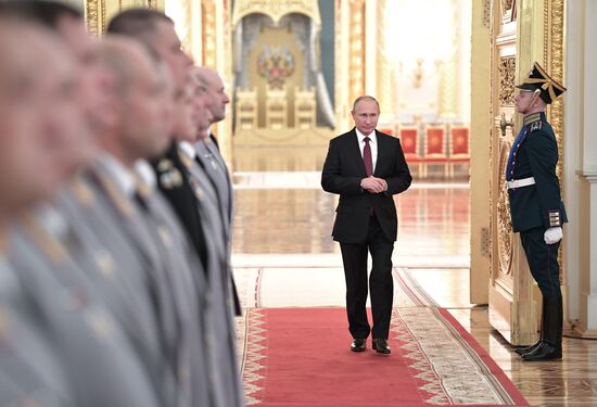 Russian President Vladimir Putin meets with senior officers at the Kremlin