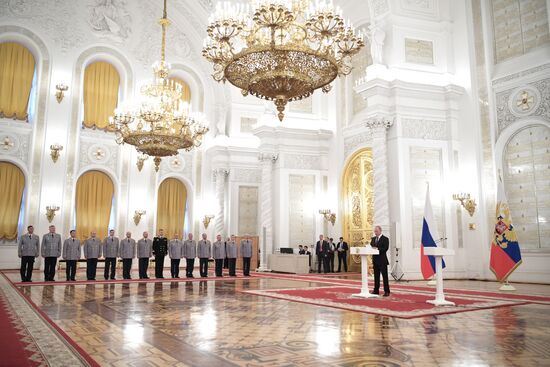 Russian President Vladimir Putin meets with senior officers at the Kremlin
