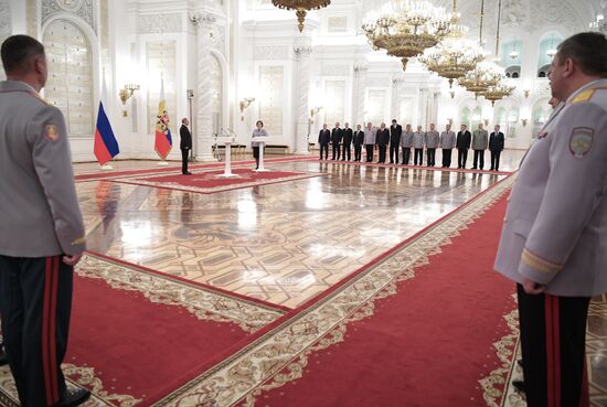 Russian President Vladimir Putin meets with senior officers at the Kremlin