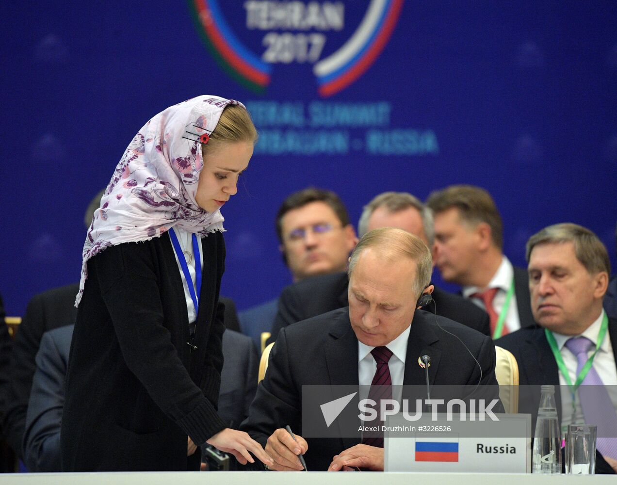 November 1, 2017. President Vladimir Putin during the signing of documents at a trilateral meeting in Tehran with President of Iran Hassan Rouhani and President of Azerbaijan Ilham Aliyev. Location: Iran, Tehran. Author: Alexei Druzhinin/Sputnik. President Vladimir Putin's working visit to Iran