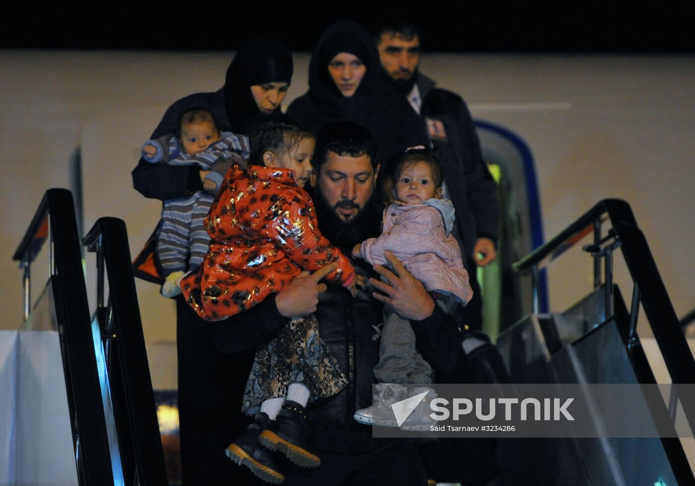 Welcoming Russian children, rescued in Syria, at Grozny Airport