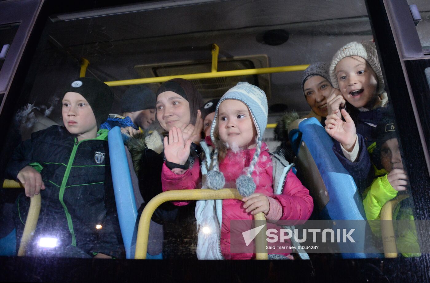 Welcoming Russian children, rescued in Syria, at Grozny Airport