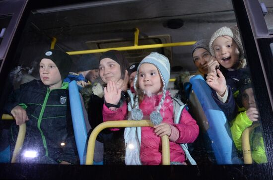 Welcoming Russian children, rescued in Syria, at Grozny Airport