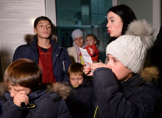 Welcoming Russian children, rescued in Syria, at Grozny Airport