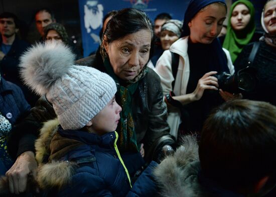 Welcoming Russian children, rescued in Syria, at Grozny Airport